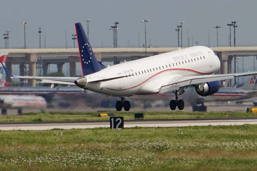  A Republic Airways jet lands at Dallas/Fort Worth International Airport in this May photo....