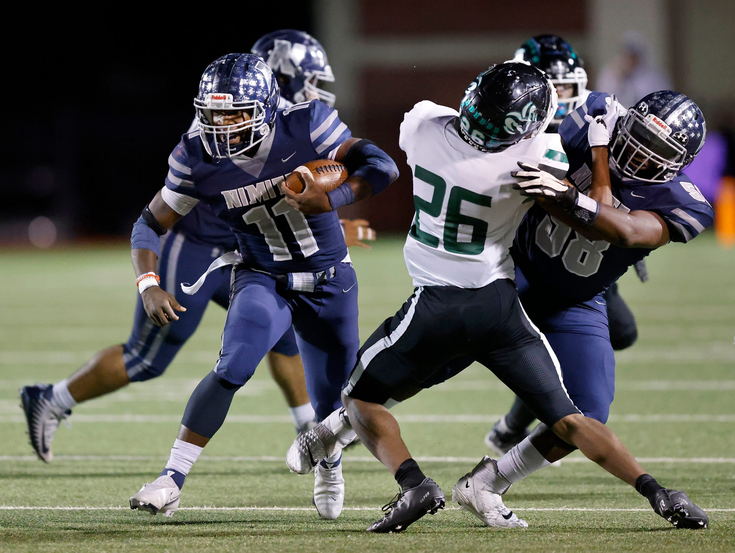 Irving Nimitz running back J'den Hall (11) carries the ball against the Richardson Berkner...