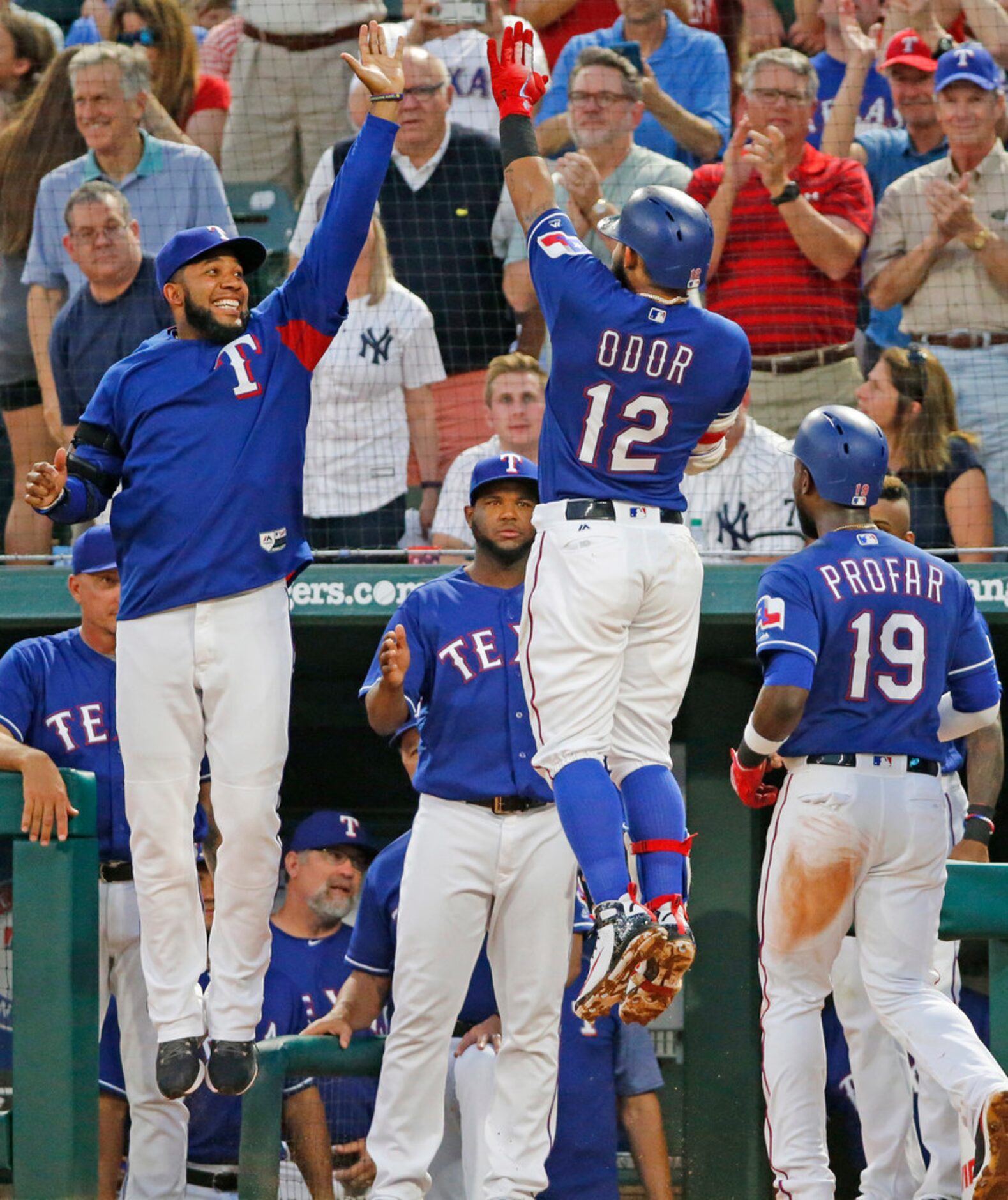 Texas Rangers second baseman Rougned Odor is congratulated teammate Elvis Andrus (1) after...