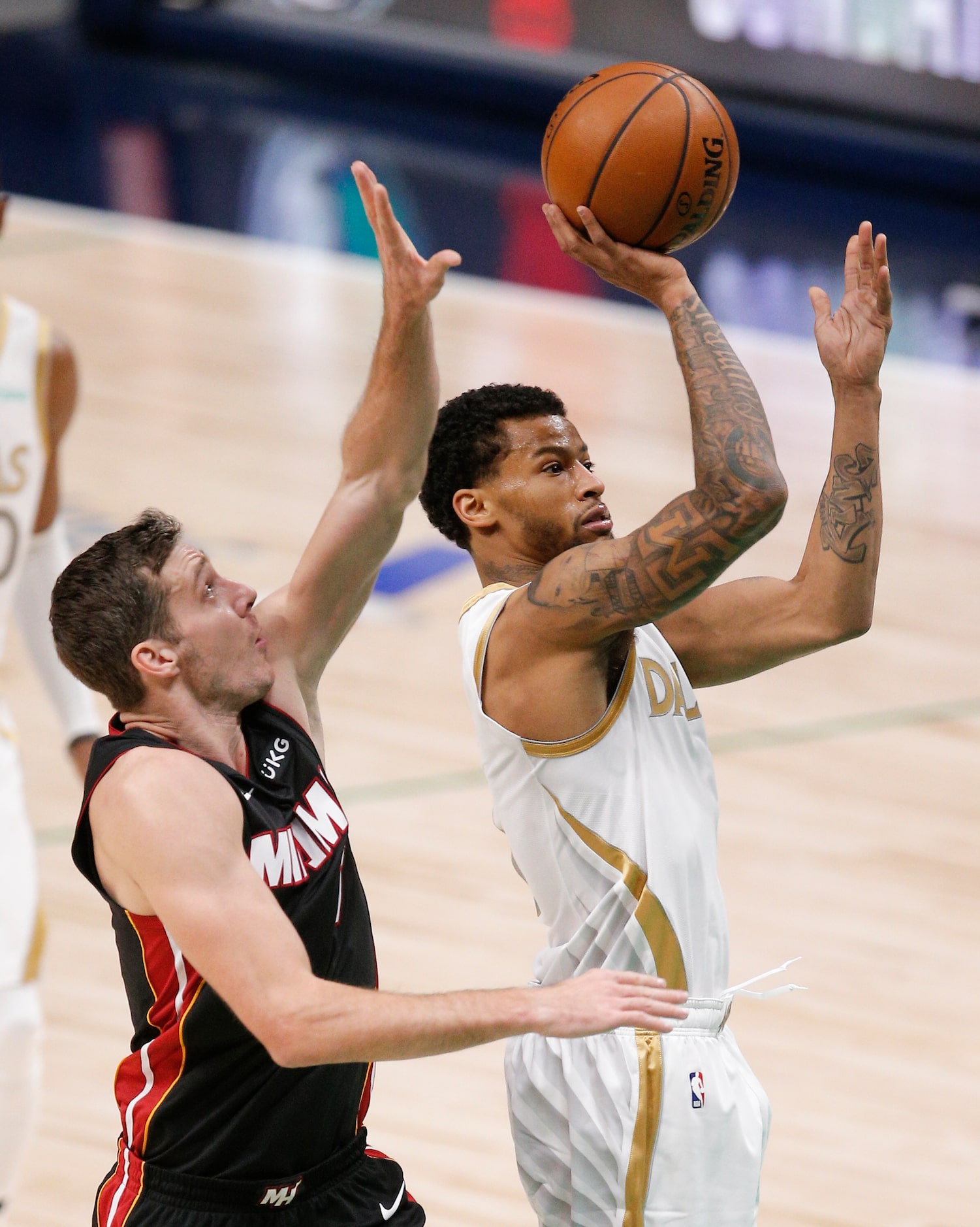 Dallas Mavericks guard Trey Burke (3)  attempts a shot as Miami Heat guard Goran Dragic (7)...