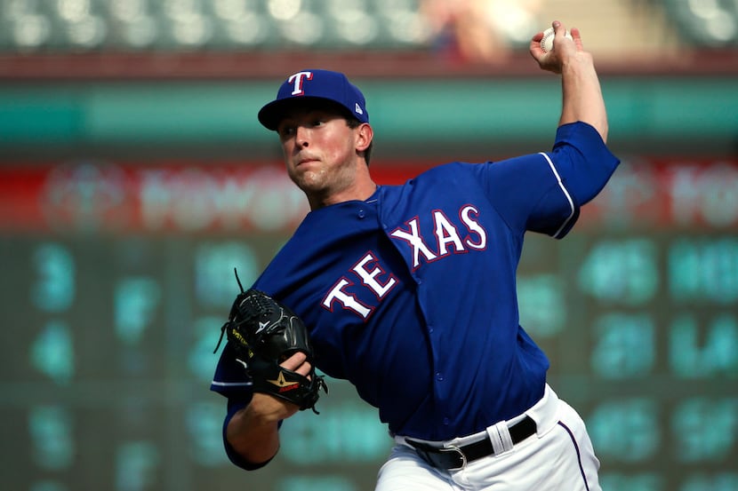 ARLINGTON, TX - AUGUST 5: Jeffrey Springs #54 of the Texas Rangers throws against the...