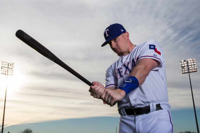 Texas Rangers left fielder Ryan Rua (16) poses for a portrait on photo day during spring...