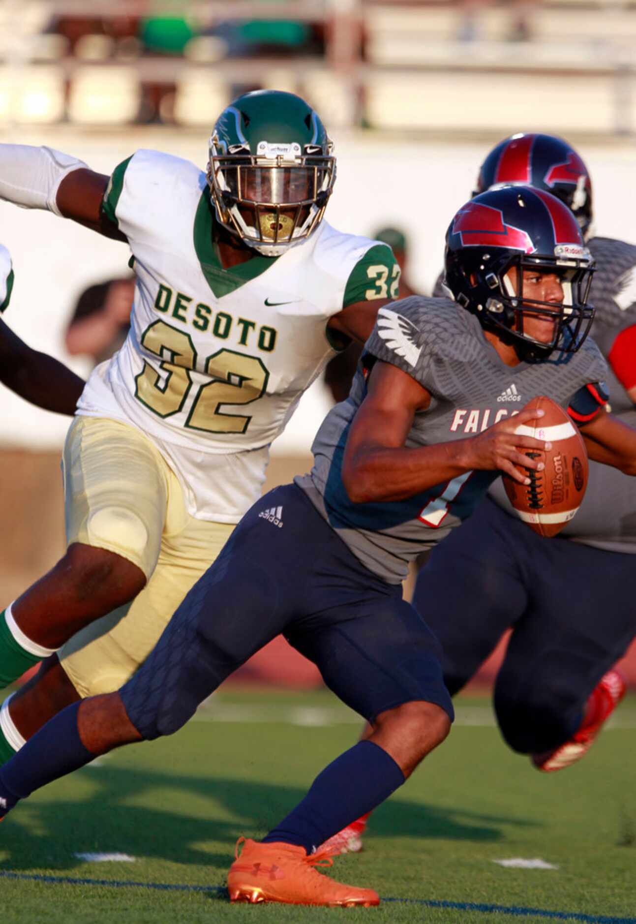 Bishop Dunne QB Simeon Evans (1) is chased by Desoto DL Shemar Turner during the first half...