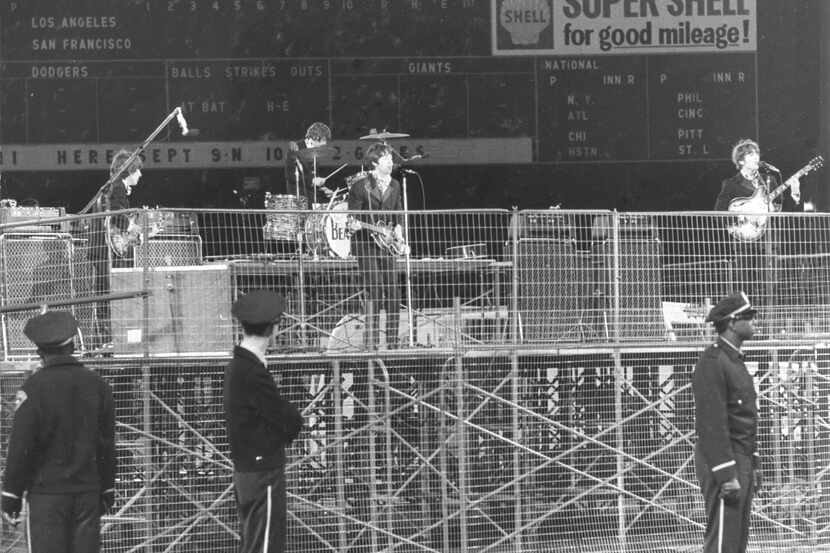 In this photo taken Aug. 29, 1966, the Beatles perform at Candlestick Park in San Francisco....