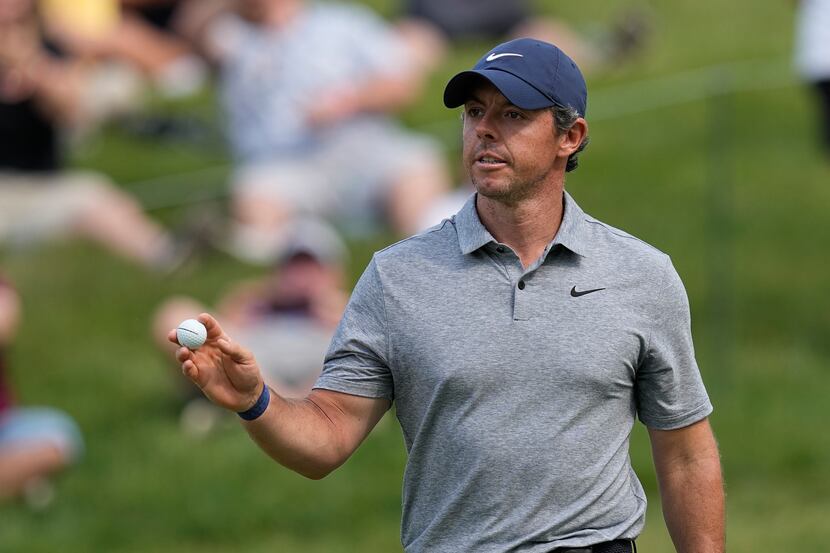 Rory McIlroy, of Northern Ireland, reacts after a birdie on the 17th hole during the third...