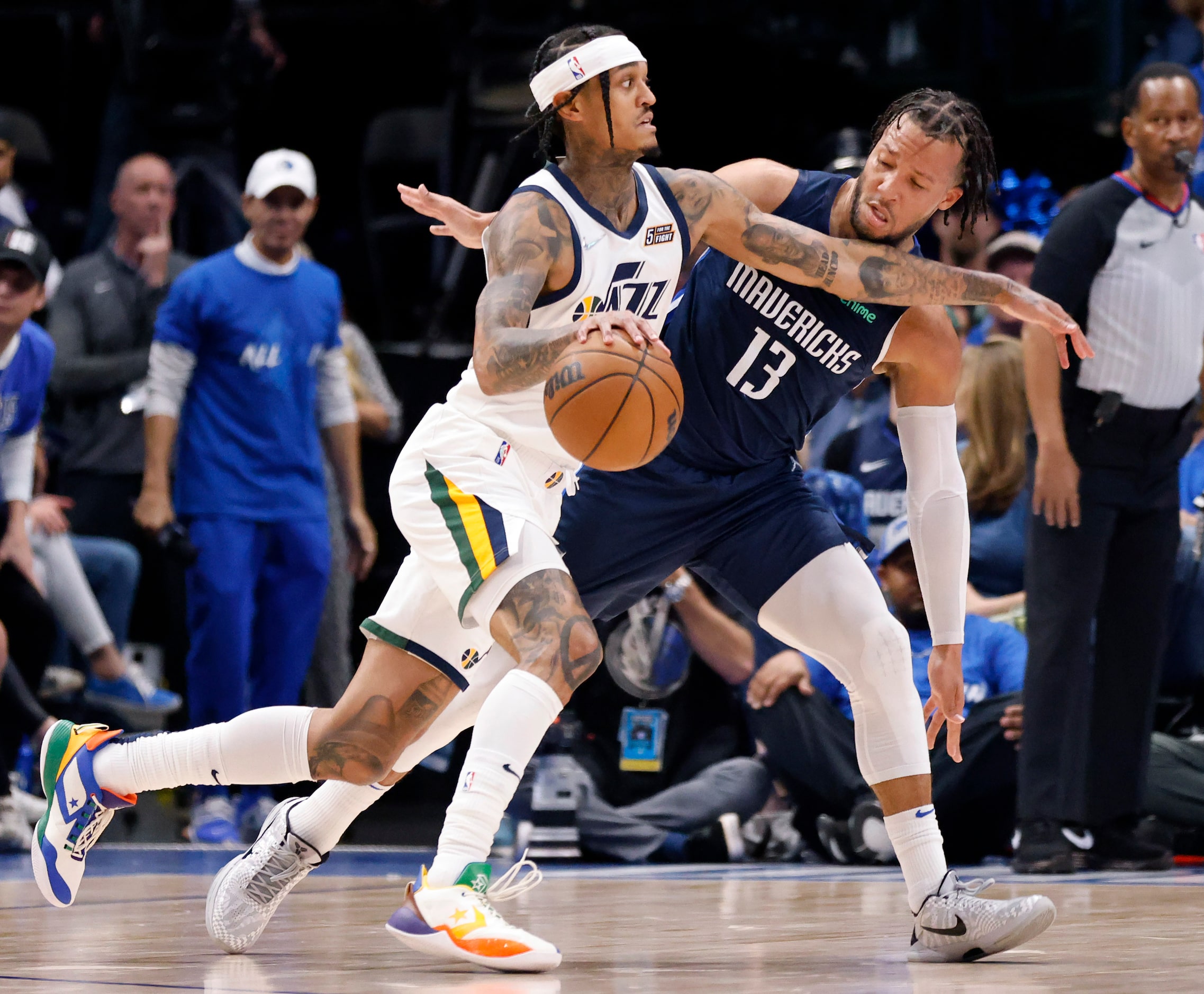 Dallas Mavericks guard Jalen Brunson (13) gruards Utah Jazz guard Jordan Clarkson (00)...