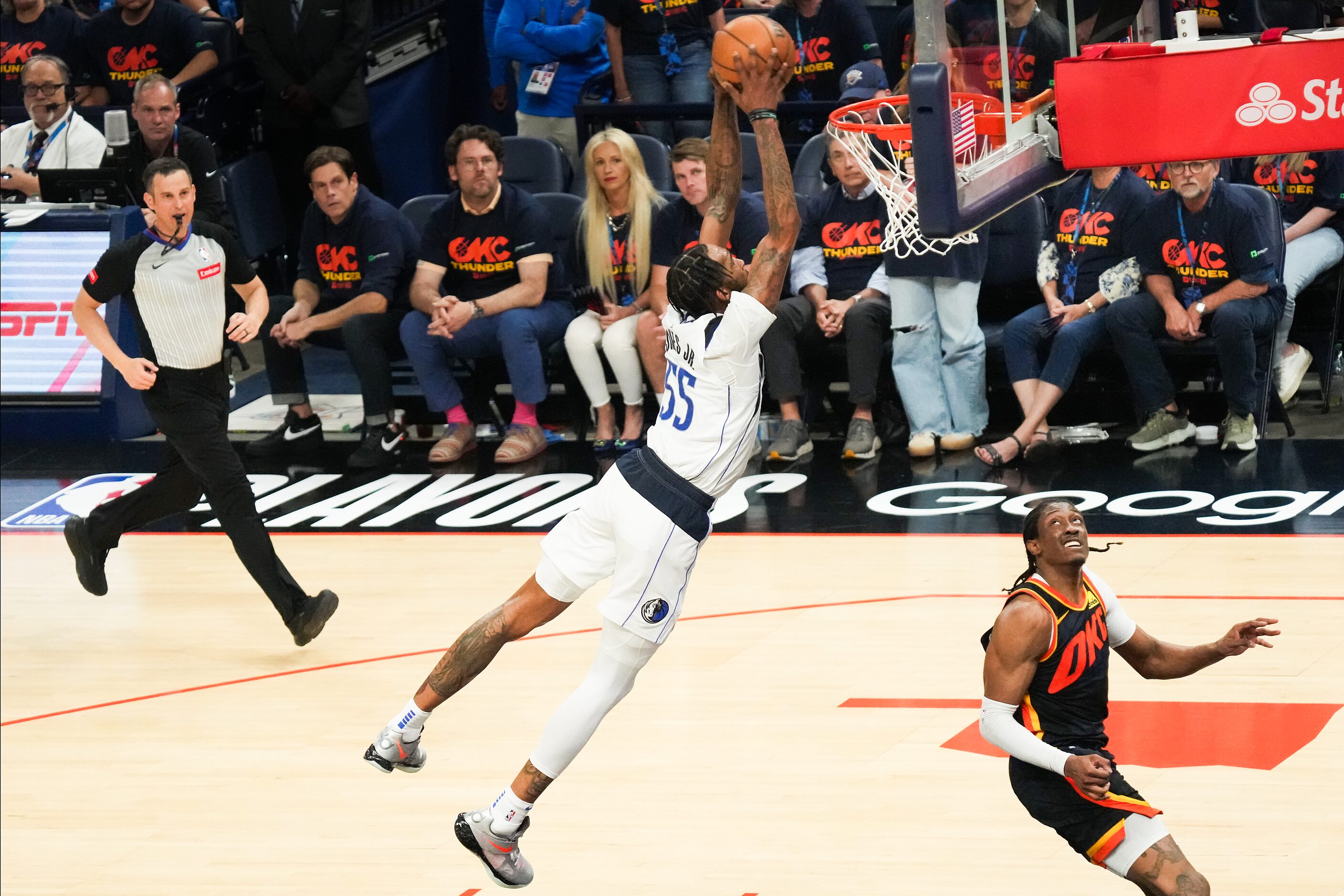 Dallas Mavericks forward Derrick Jones Jr. (55) dunks the ball past Oklahoma City Thunder...