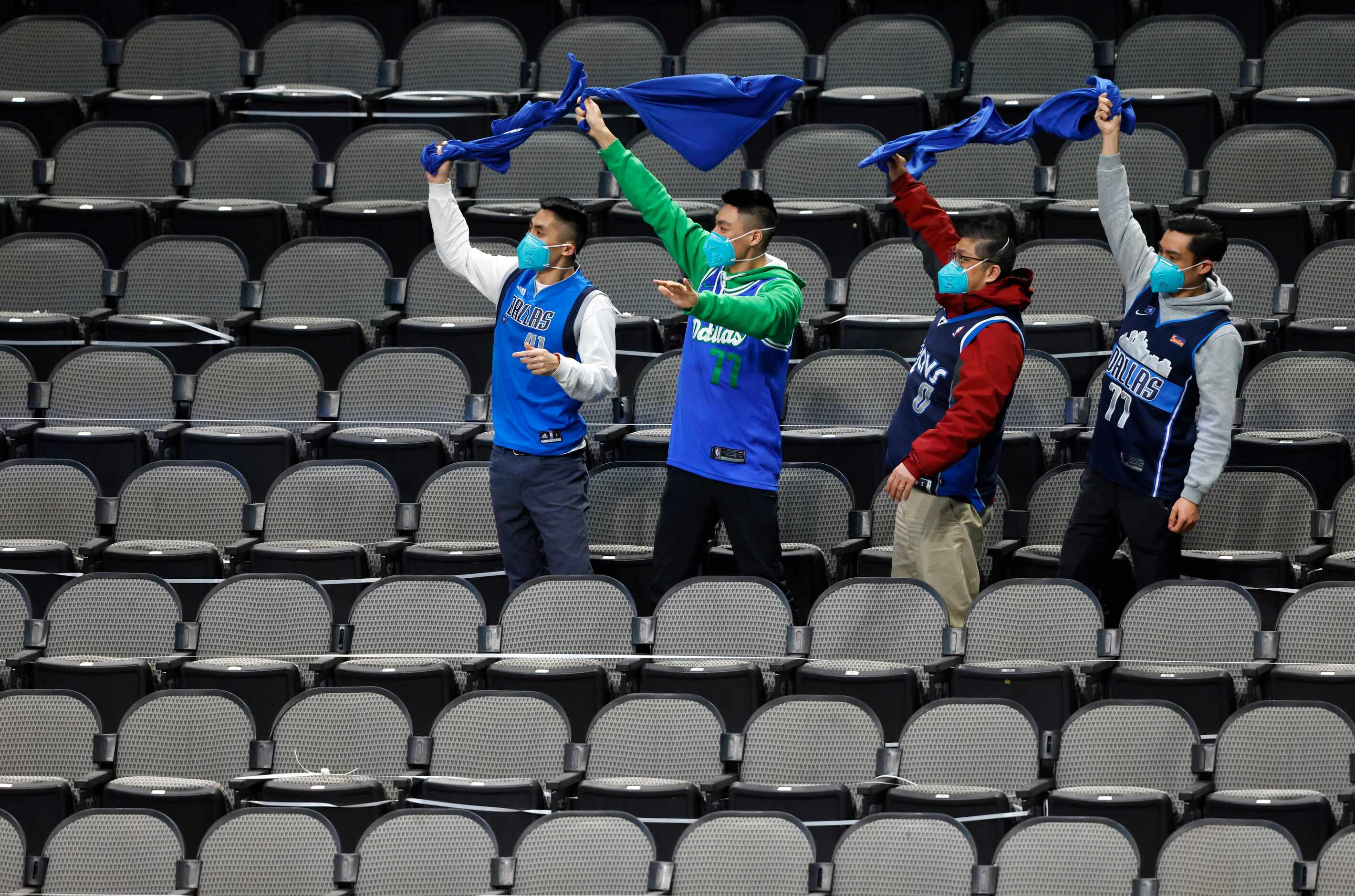 Dallas Mavericks fans celebrate as they play against the Minnesota Timberwolves during the...
