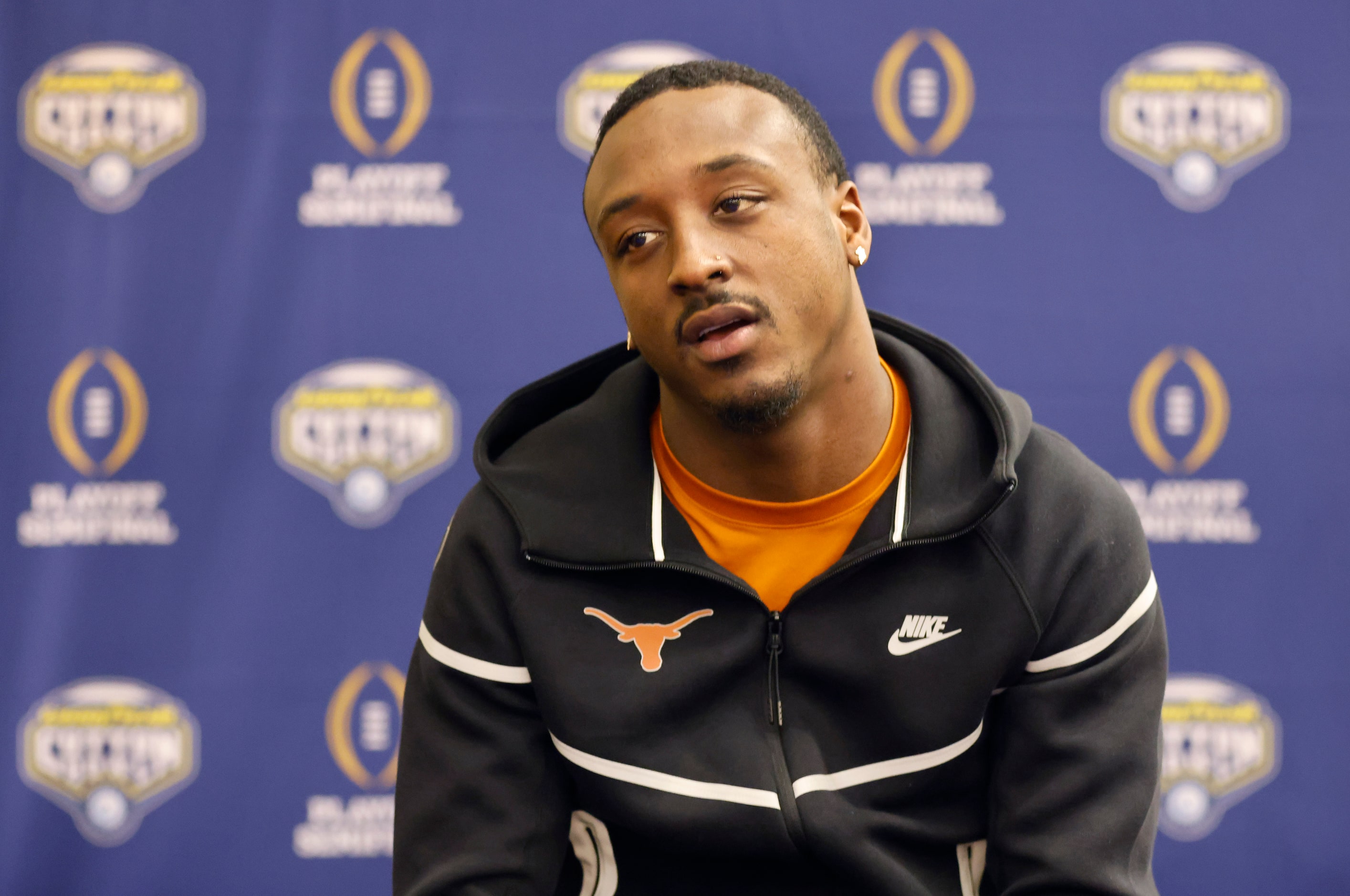 Texas Longhorns running back Quintrevion Wisner of Glenn Heights answers questions from the...