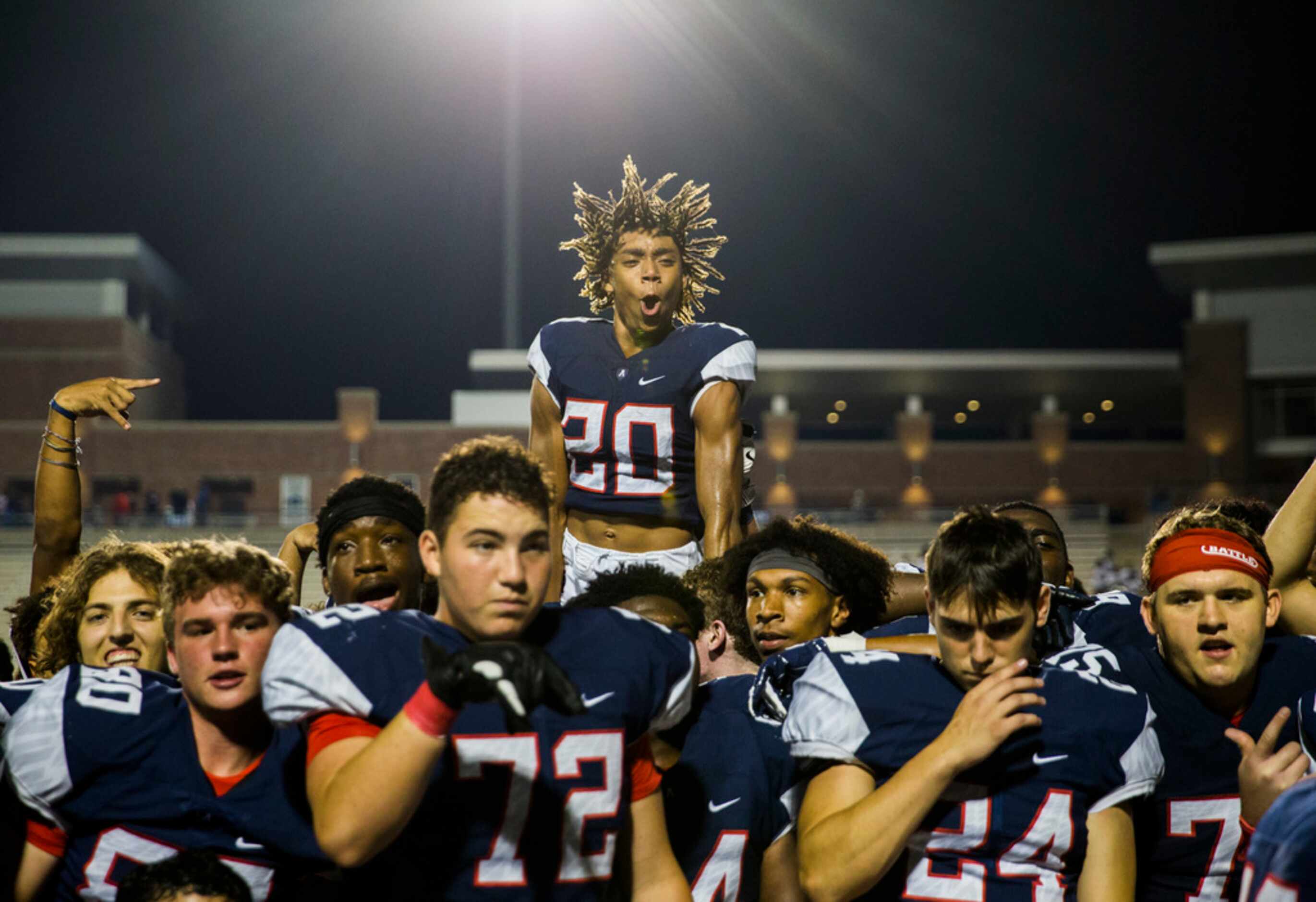 Allen defensive back Braydon Manning (20) jumps up over his team after a 41-28 win over...