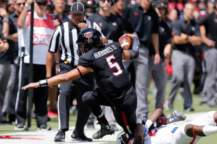 Texas Tech quarterback Patrick Mahomes (5) is tackled by Sam Houston State's Mikell Everette...