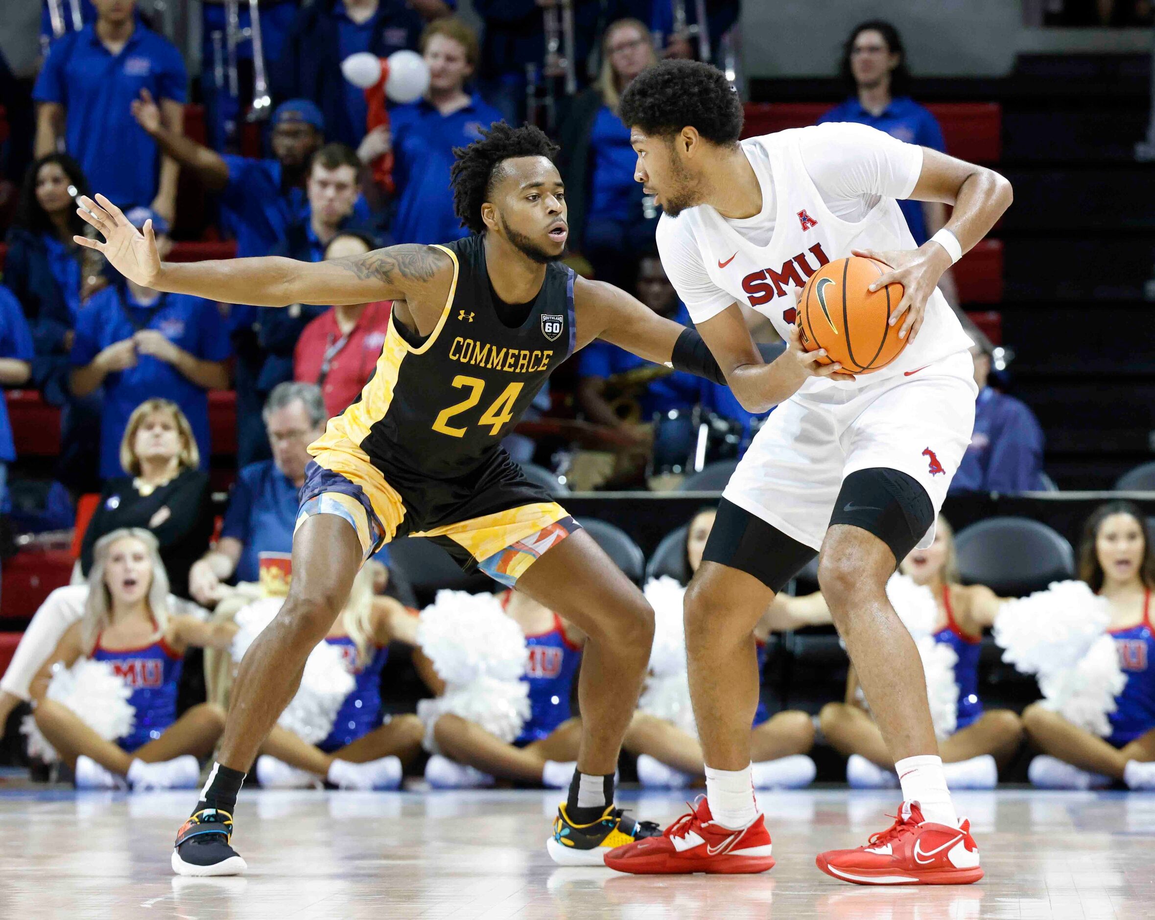 Southern Methodist center Mo Njie (13) looks to pass past Texas A&M-Comm’s forward Jerome...