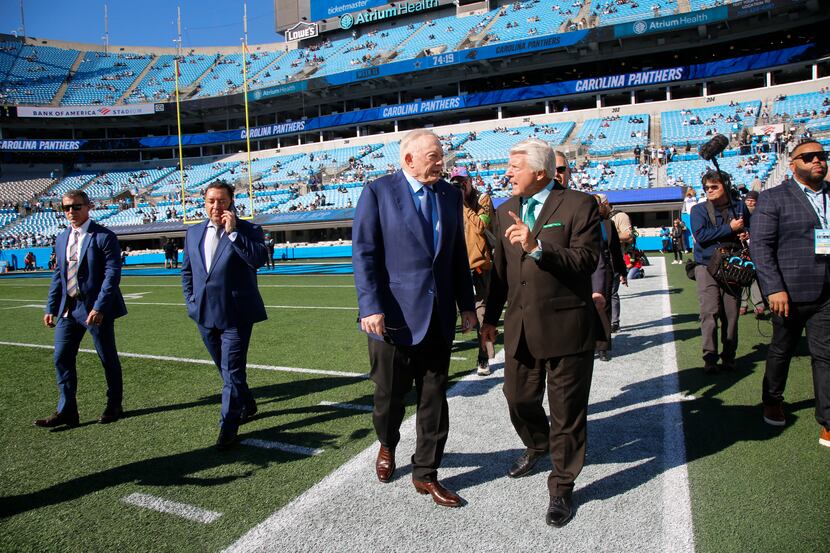 Dallas Cowboys owner Jerry Jones chats with Pro Football Hall of Fame coach Jimmy Johnson...