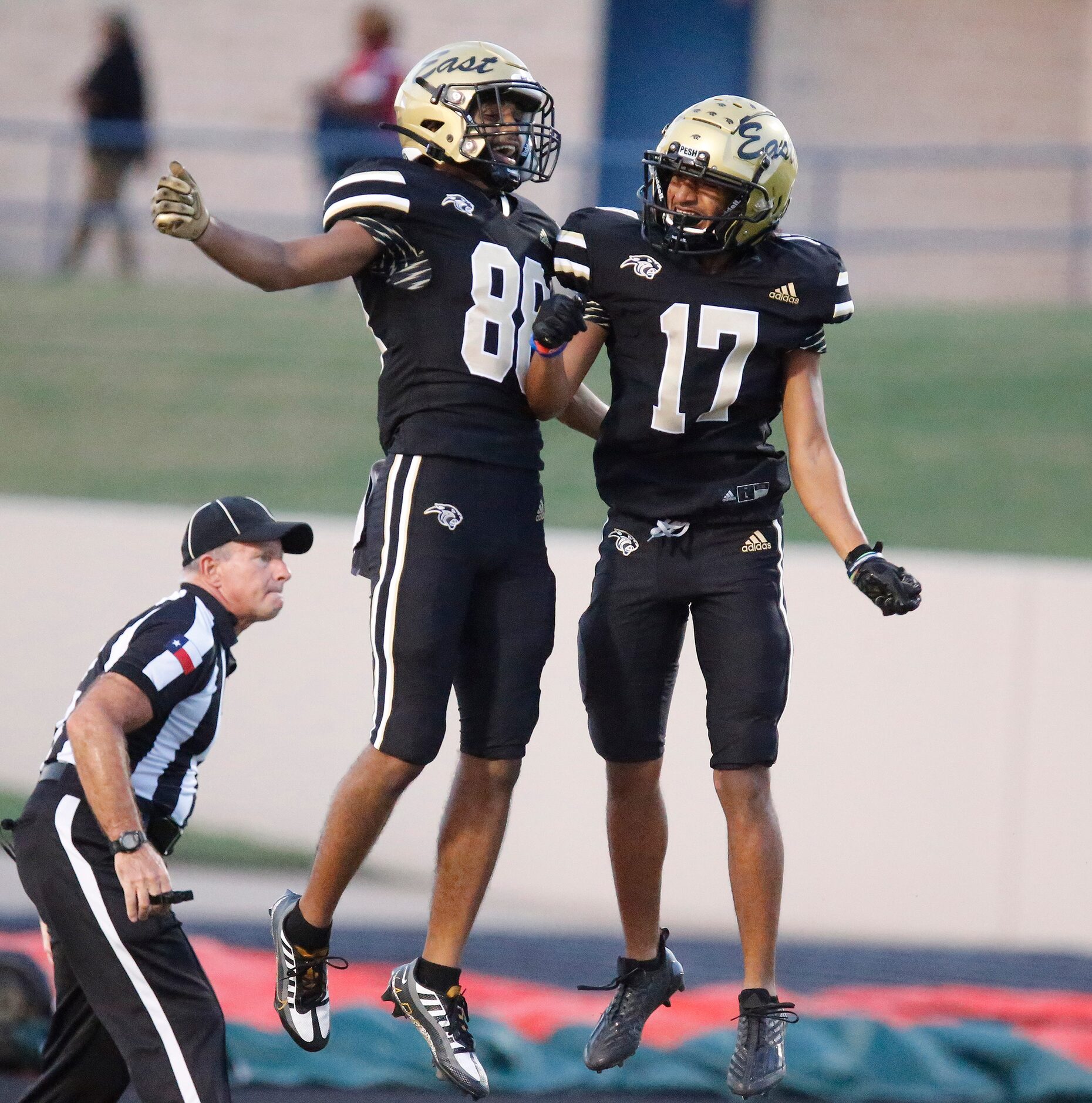 Plano East Senior High School wide receiver Rushil Patel (88) celebrates scoring his...