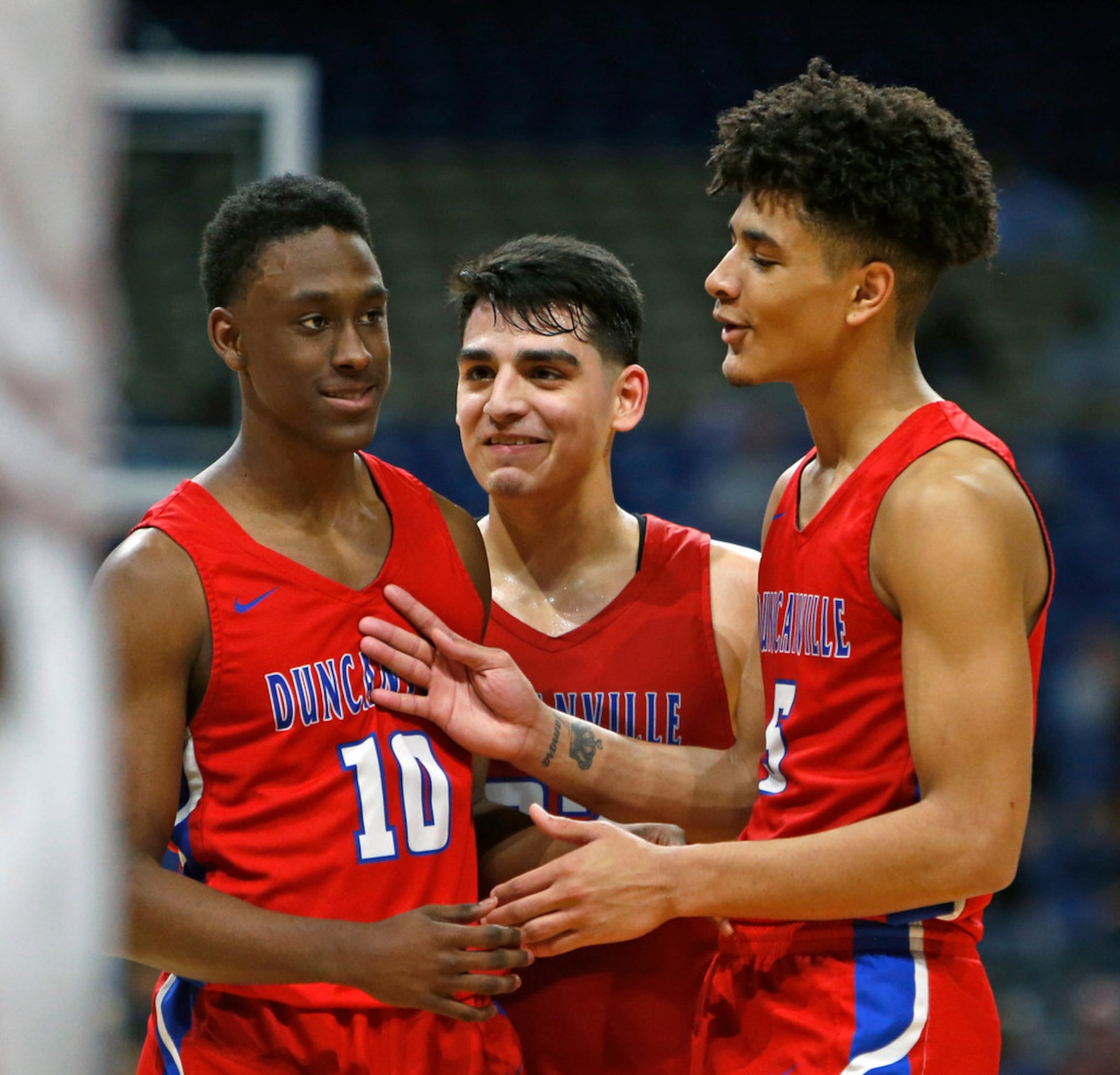 Duncanville's Damon Nicholas #10, Duncanville's Derek Luna #23,C, and Duncanville's Micah...