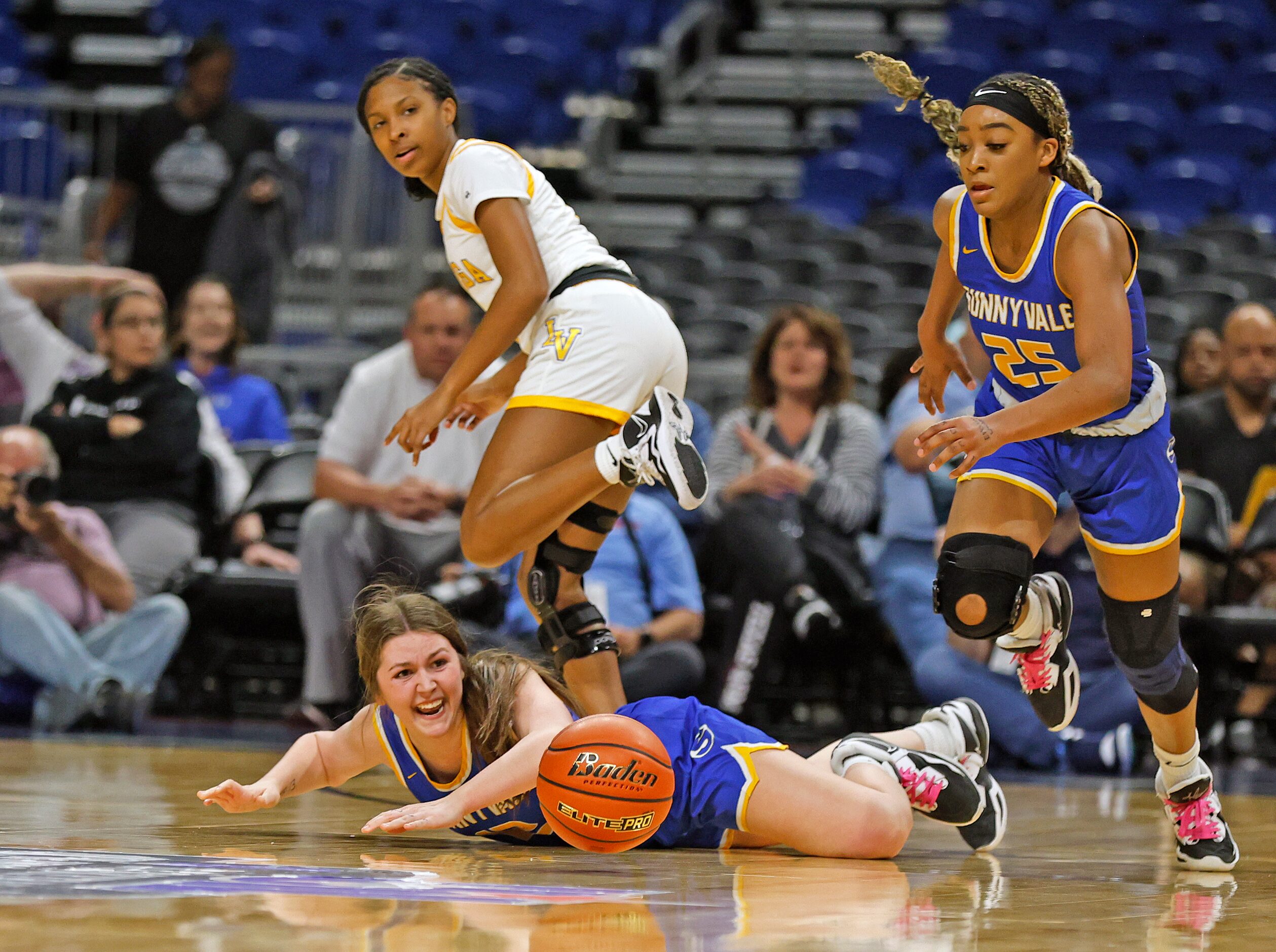 Sunnyvale Sarah Griffin (12) watches the ball get away from her during girls basketball...