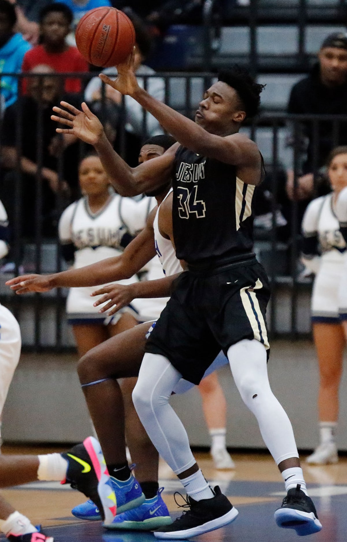 Dallas Jesuit forward Julius Marble (34) tries to pass during the first half as South...