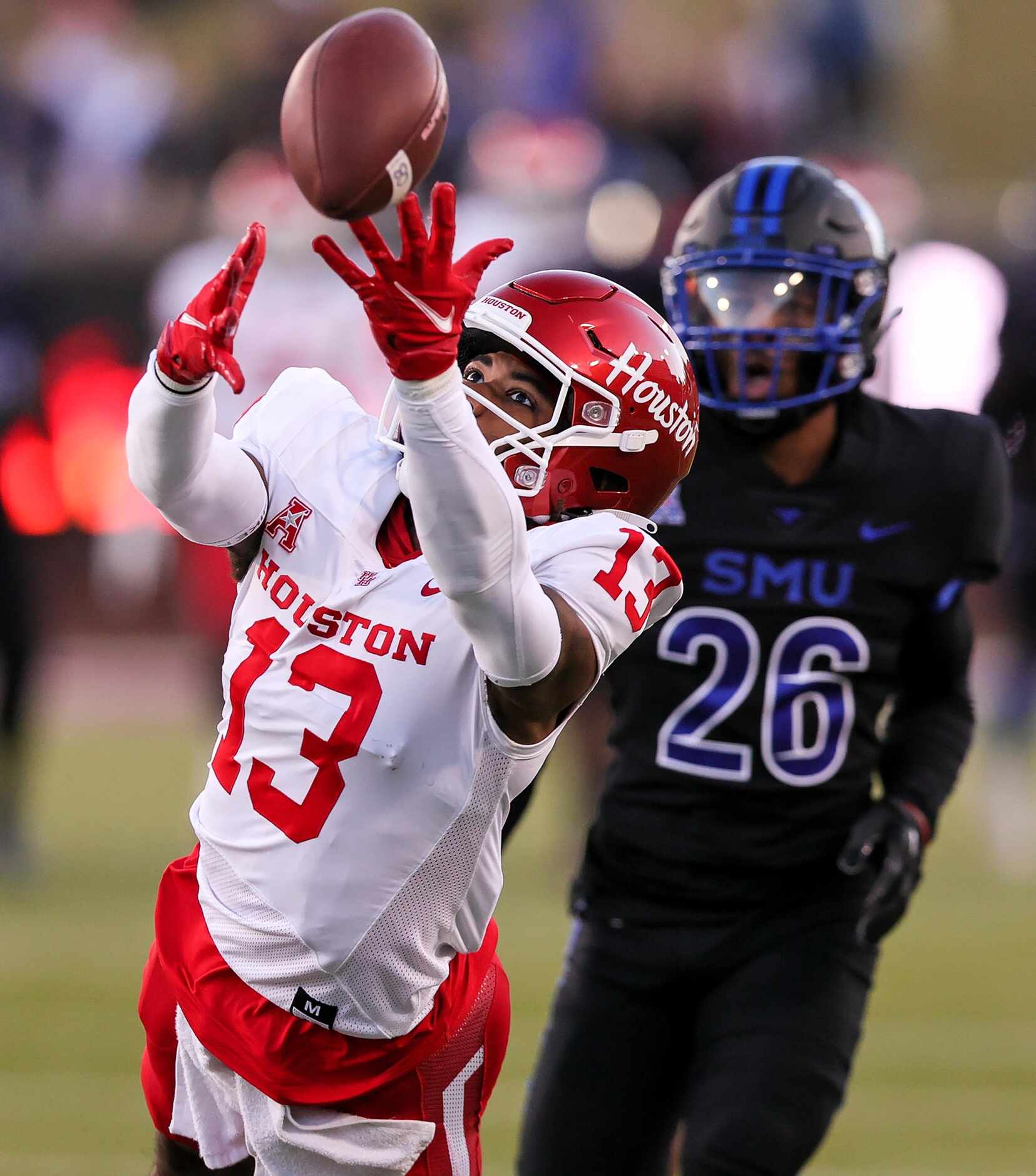 Houston wide receiver Sanuel Brown (13) stretches out for a pass in front of SMU cornerback...