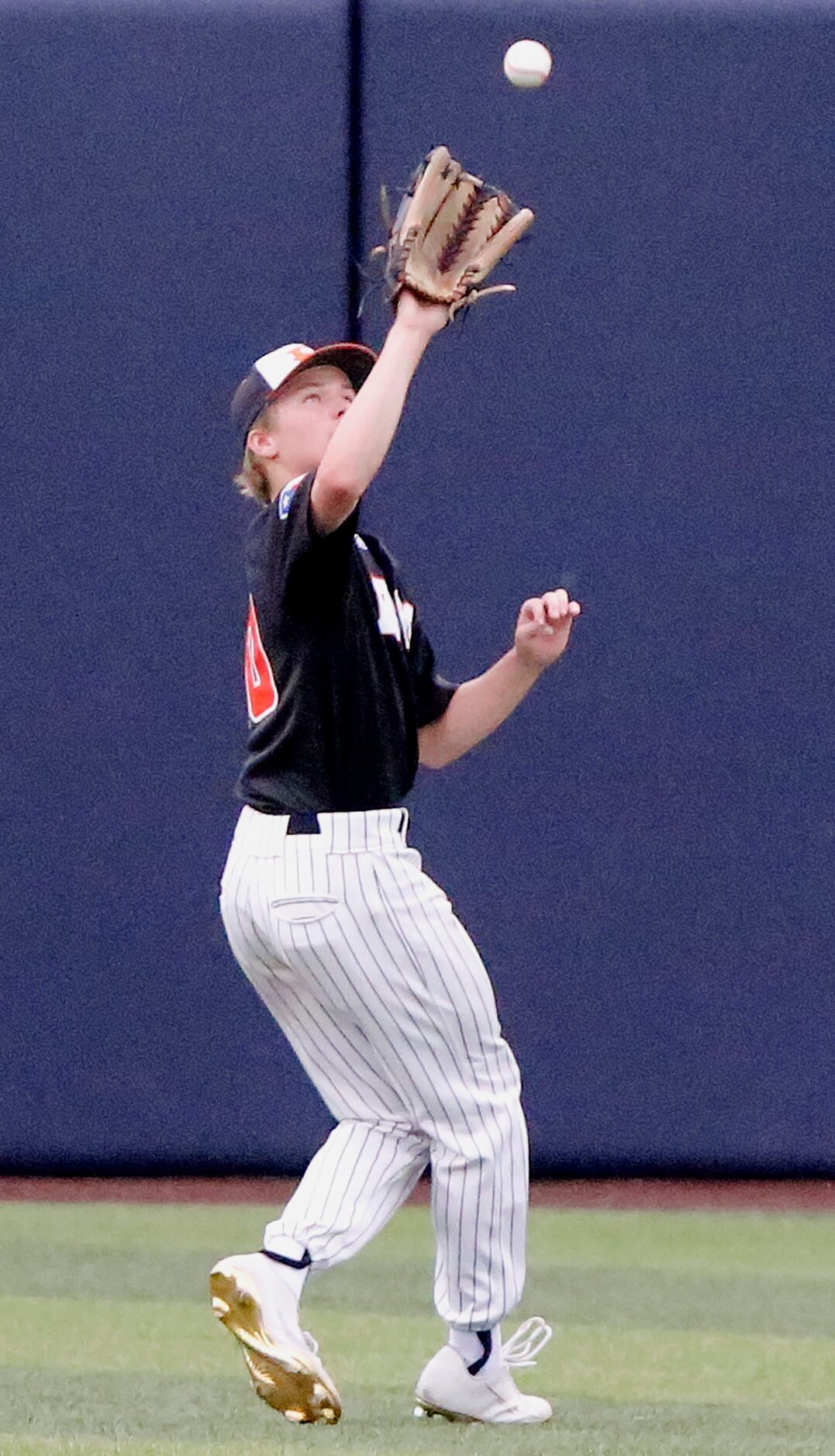 Rockwall left fielder Barrett Riebock (1) catches a fly ball to end the first inning as...