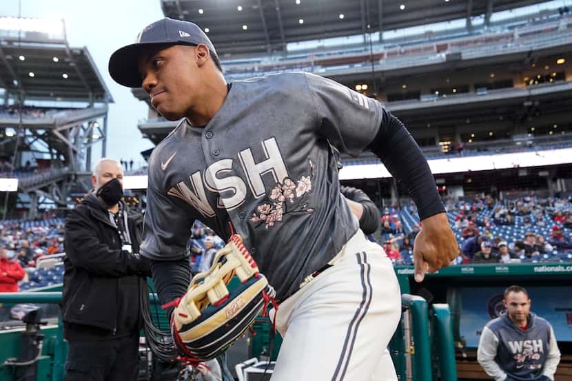 Washington Nationals' Juan Soto, wearing the City Connect jersey, takes the field before the...