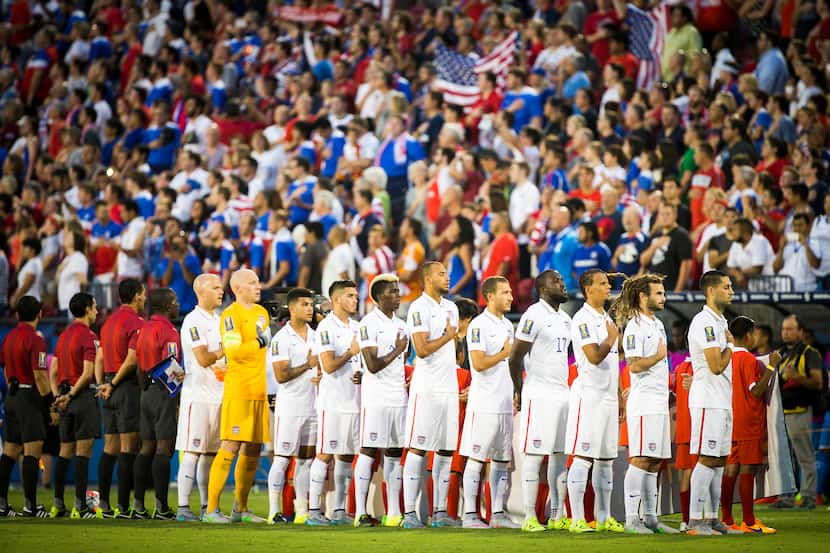 Team USA players stand for the national anthem before facing Honduras in a CONCACAF Gold Cup...