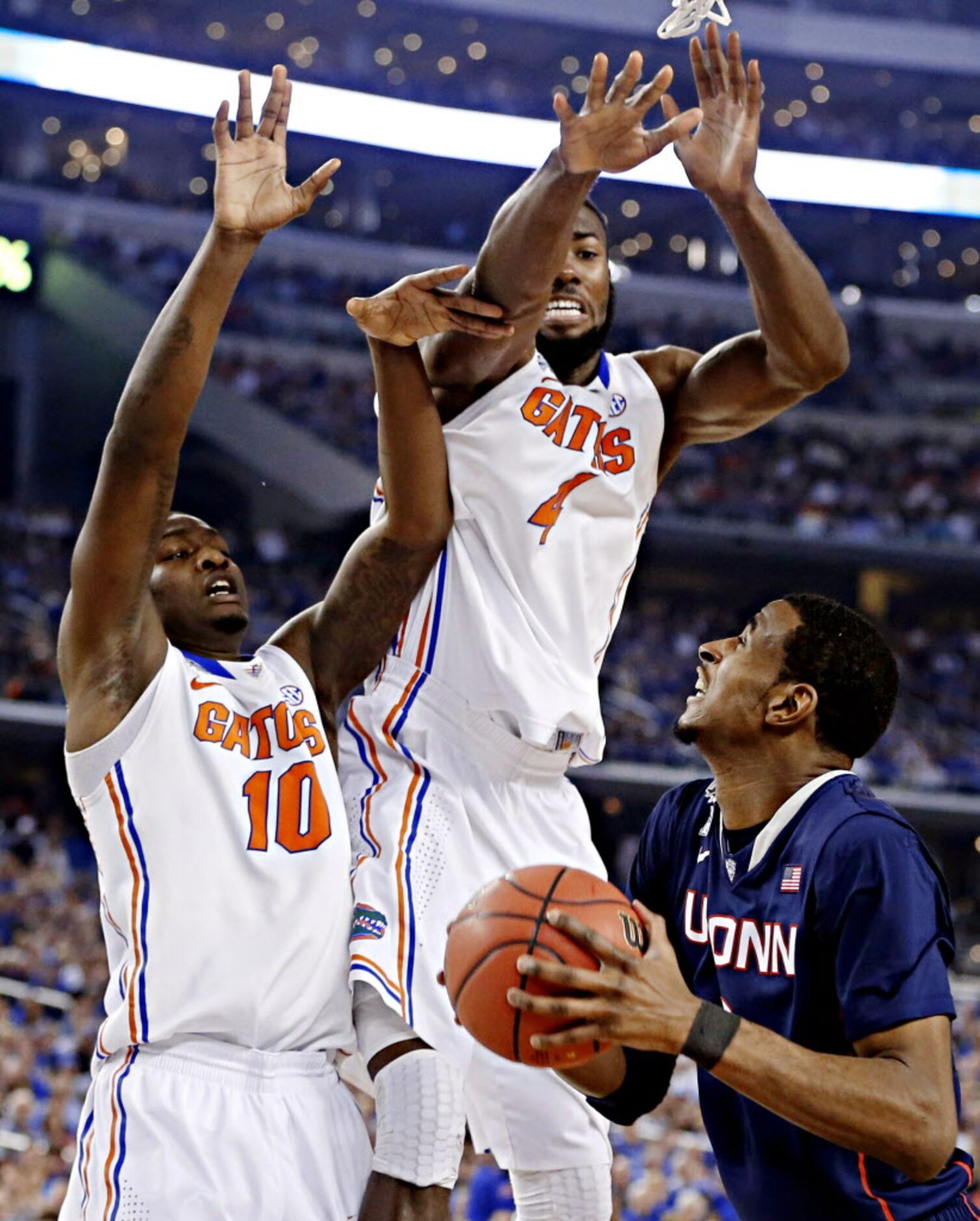 Florida Gators forward Dorian Finney-Smith (10) and center Patric Young (4) defend...