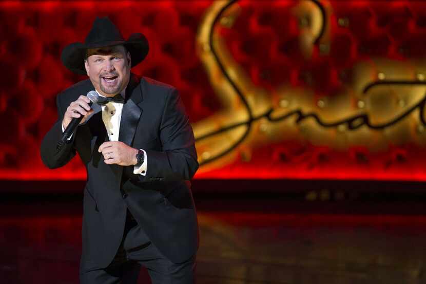FILE - In this Dec. 2, 2015 file photo, Garth Brooks performs during the Sinatra 100 - An...