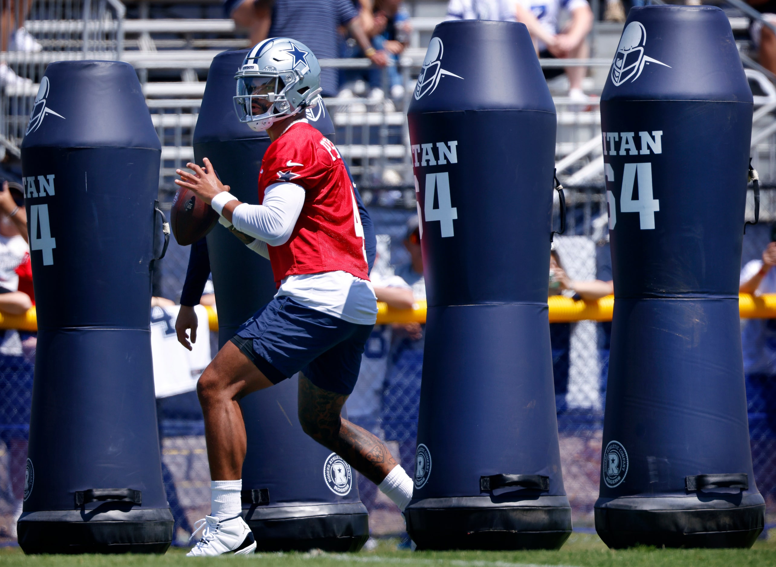 Dallas Cowboys quarterback Dak Prescott (4)  maneuvers through the tackling dummies before...