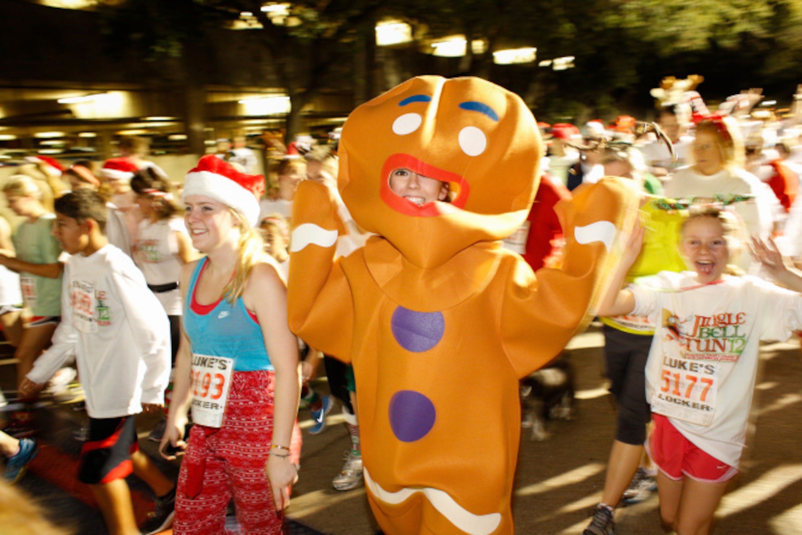 Thousands of runners take the streets for the Jingle Bell Run outside the Hilton Anatole in...