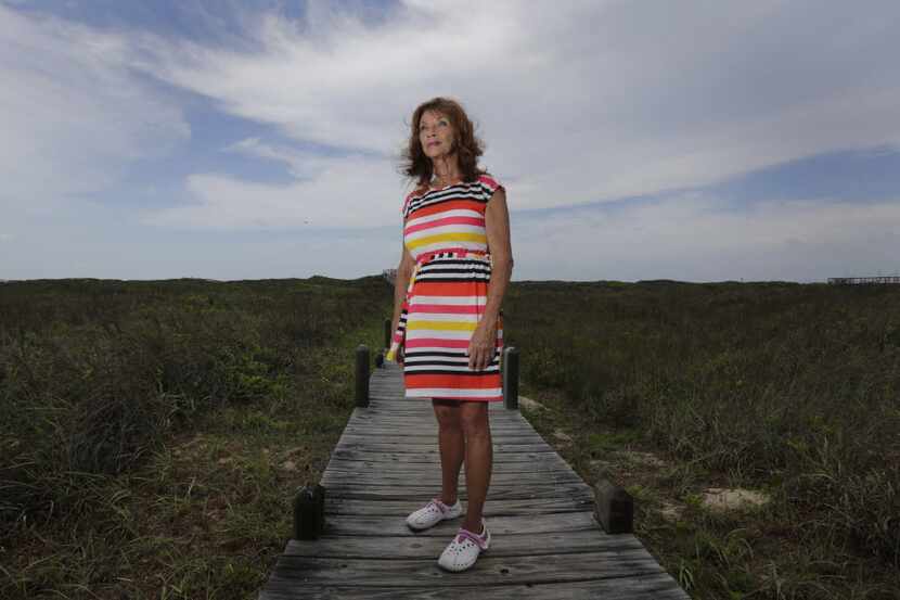 Sonia Cacy poses for a photo on a boardwalk near her home, Tuesday, June 24, 2014, in Port...