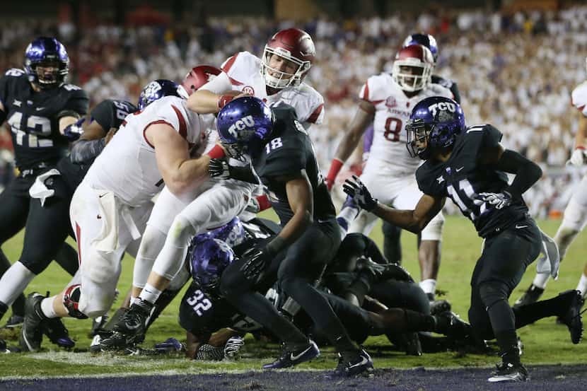 Arkansas quarterback Austin Allen (8) scores for a rushing touchdown in double overtime to...