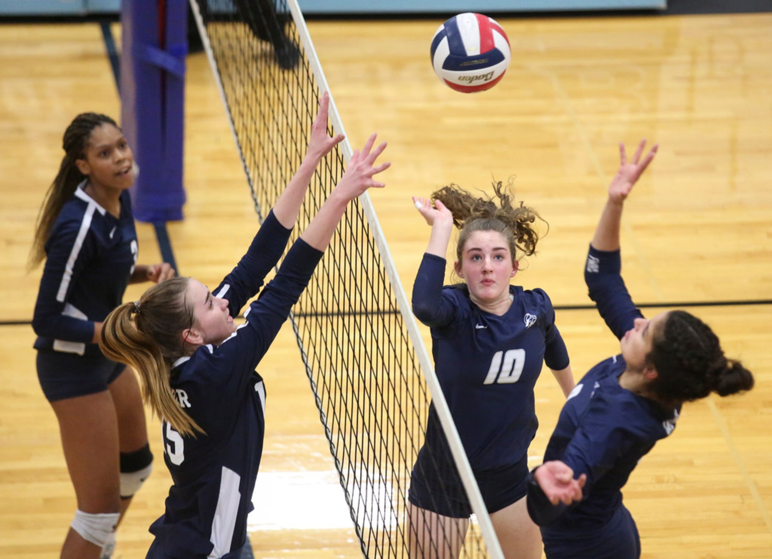 Megan Farris (10) of Flower Mound sets up the ball for her teammate during a high school...