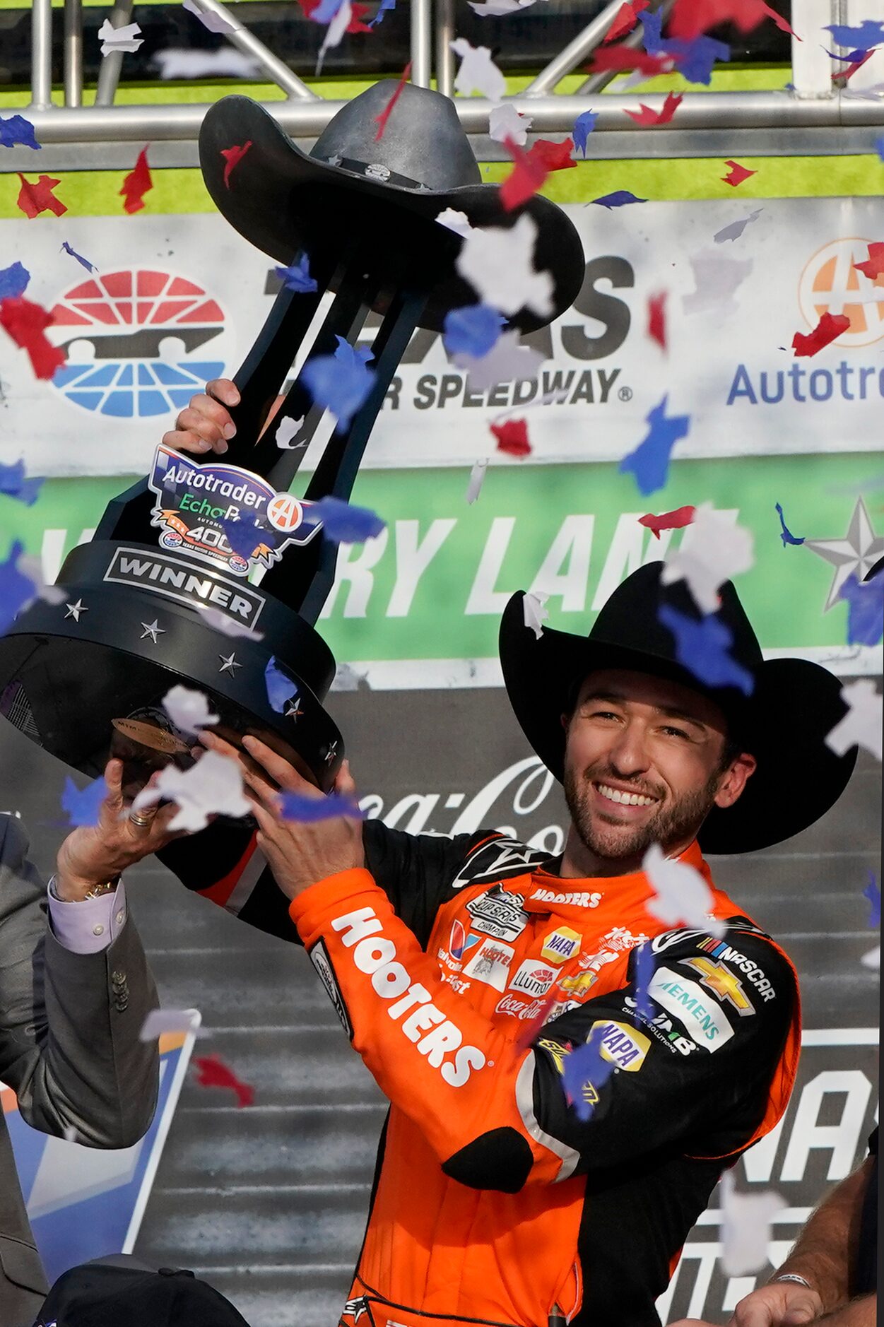 Chase Elliott celebrates with the trophy after winning a NASCAR Cup Series auto race at...