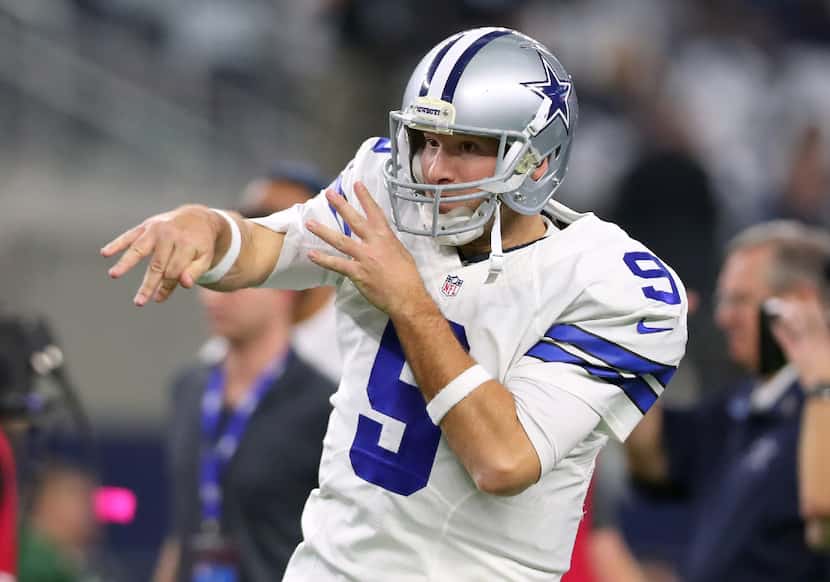 ARLINGTON, TX - JANUARY 15:  Tony Romo #9 of the Dallas Cowboys warms up on the field prior...