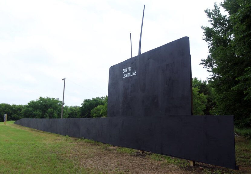 This plywood USS Dallas used to be parked on Riverfront Boulevard. But the land is now...