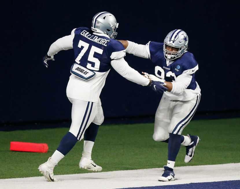 Dallas Cowboys defensive tackle Gerald McCoy (93) runs through a drill with Dallas Cowboys...