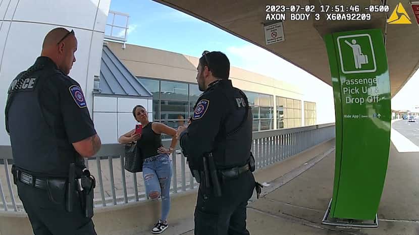 Tiffany Gomas, then 38, is seen talking to officers outside a terminal at DFW Airport on...
