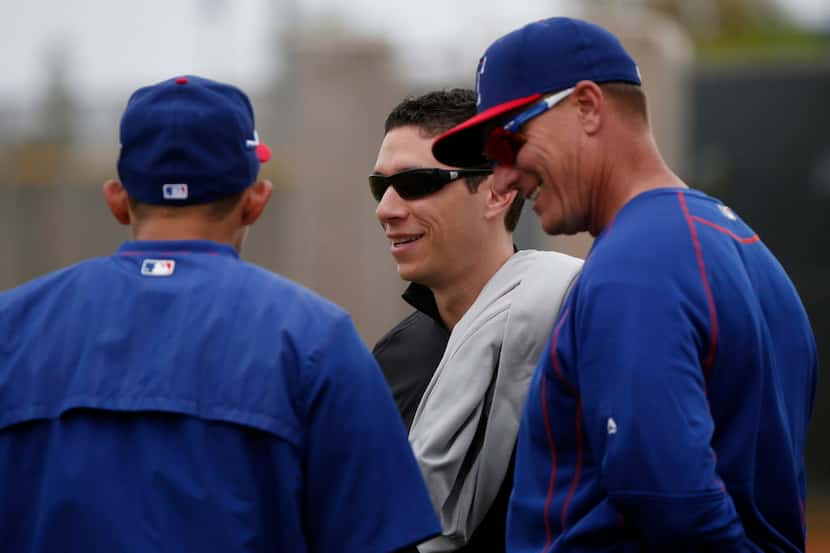 Texas Rangers infielder Rougned Odor (left), general manager Jon Daniels (center) and...