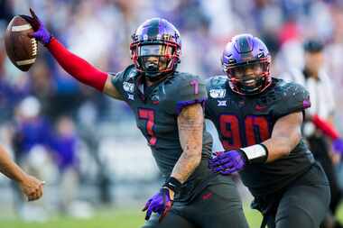 TCU Horned Frogs safety Trevon Moehrig (7) celebrates an interception with defensive tackle...