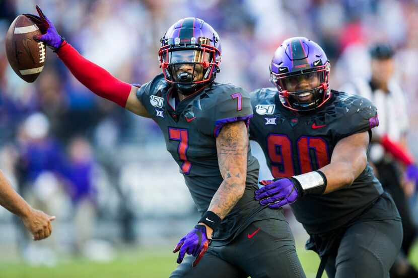 TCU Horned Frogs safety Trevon Moehrig (7) celebrates an interception with defensive tackle...