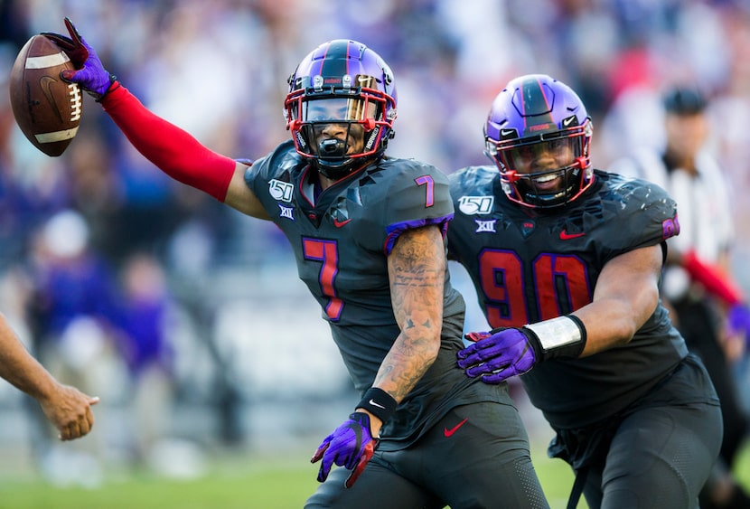 TCU Horned Frogs safety Trevon Moehrig (7) celebrates an interception with defensive tackle...