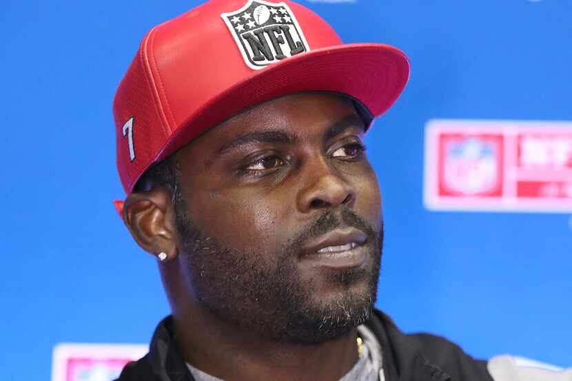 File-This jan. 31, 2019, file photo shows former Falcons and Eagles quarterback Michael Vick...