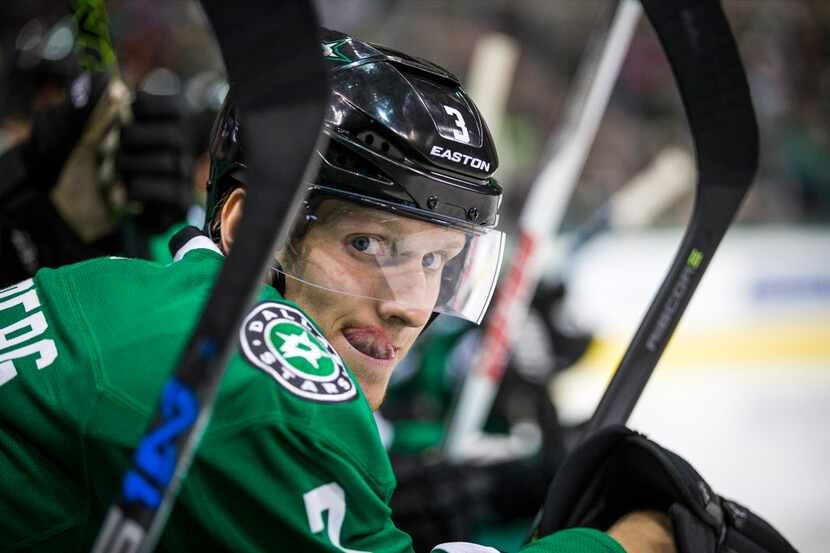 Dallas Stars defenseman John Klingberg watch the action from the bench during the second...