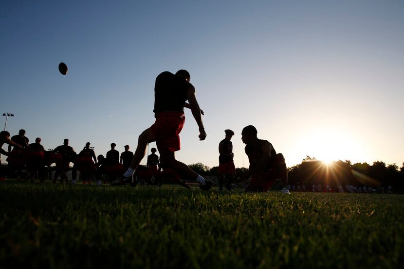 A field goal kick on the morning of the first day of football practice at Cedar Hill High...