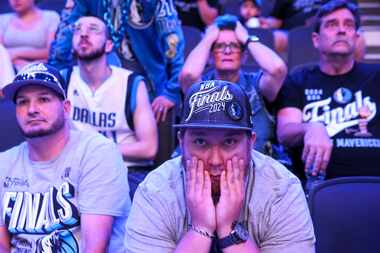 Jason Hicks (center), alongside the crowd looks dejected during a watch party after Dallas...