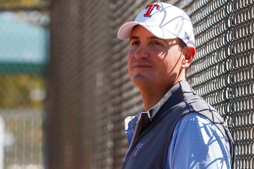 Texas Rangers general manager Chris Young observes a batting practice during a spring...