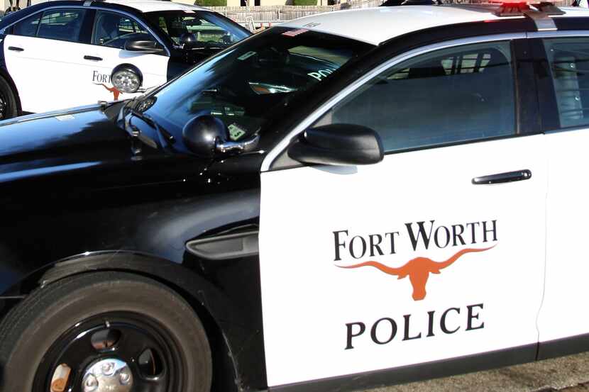 Fort Worth Police block the road as smoke fills the sky as Evergreen Paper Recycling burns...