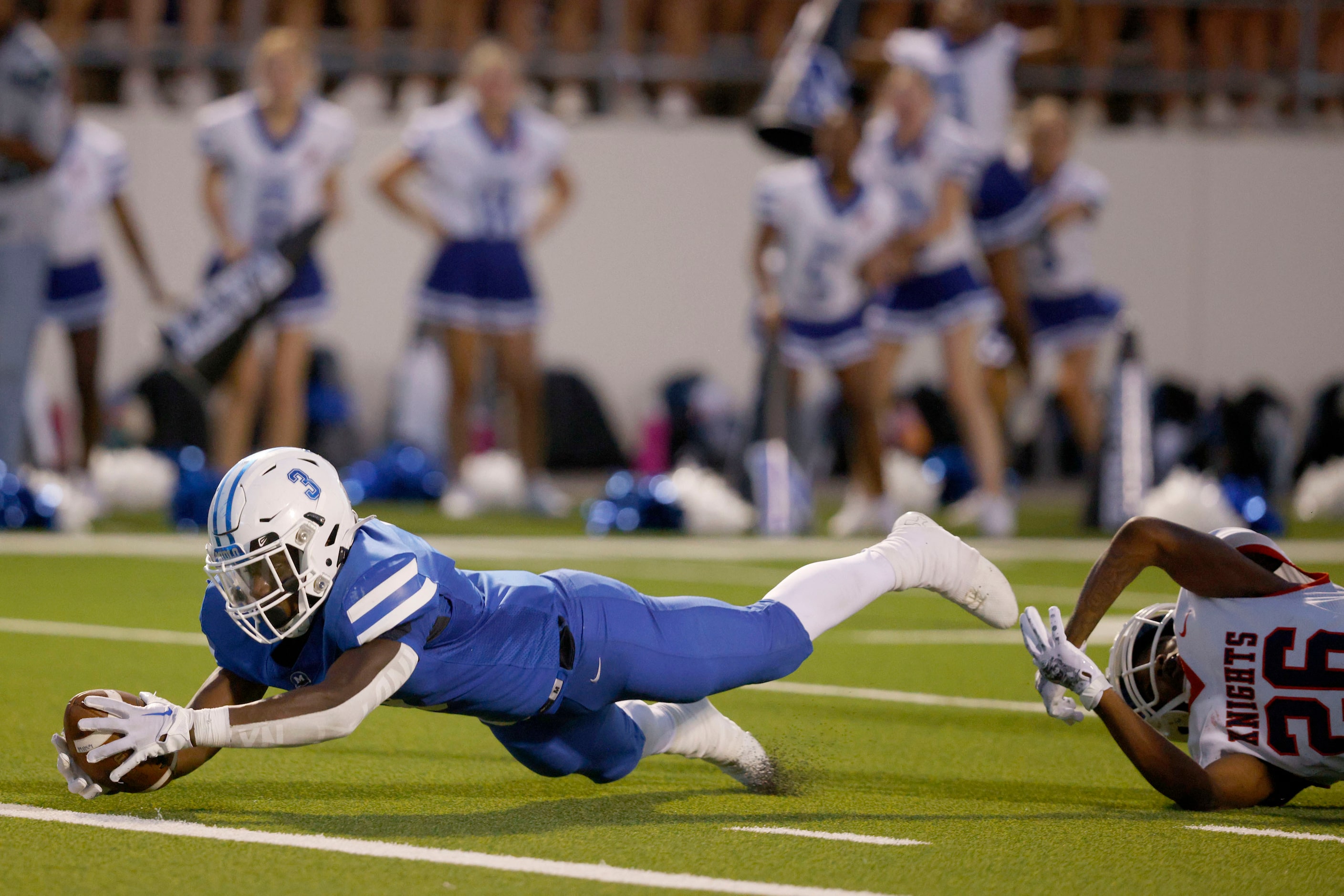 Midlothian's David Aborisade (3) scores a touchdown over Kimball's Markevan Cofer (26) in...