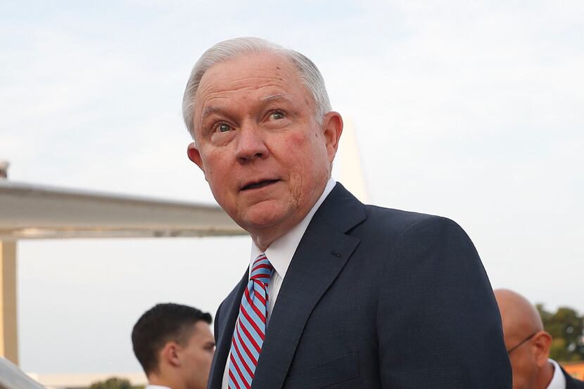 Attorney General Jeff Sessions boards his plane at Andrews Air Force Base, Md., Thursday,...