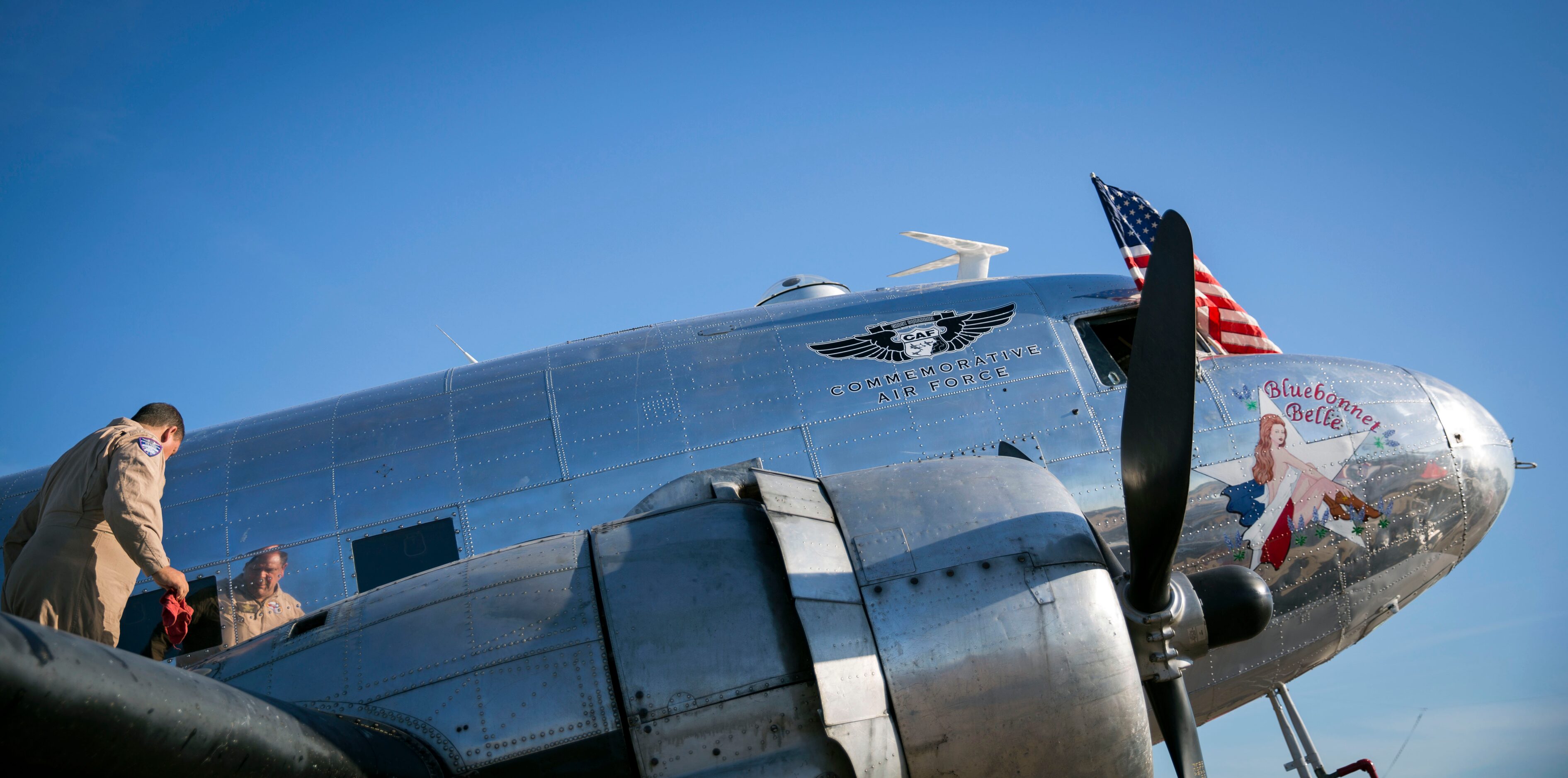 Dave Bonorden of the Highland Lakes Squadron performs maintenance checks on a C-47...